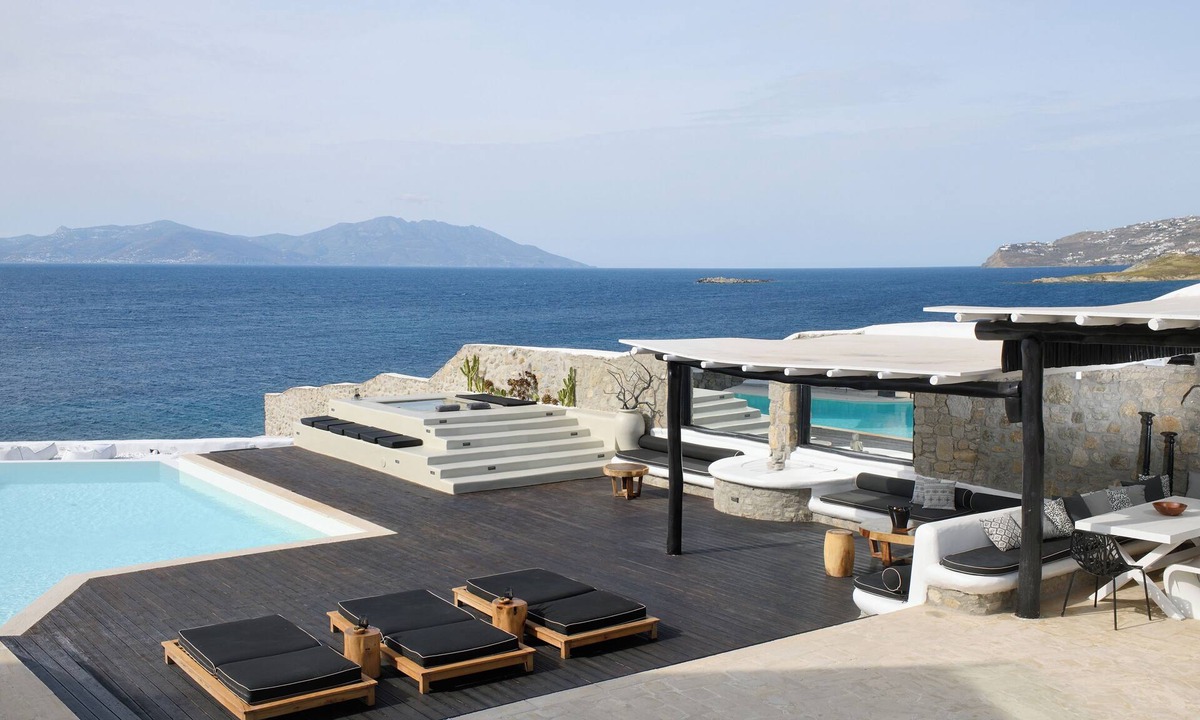 Agios Ioannis Villa | Luxurious Sunset Sea Front 5 Master bedroom villa with exterior hot tub.