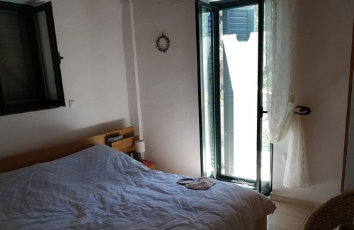 Lefktron House | Greek 140 m2 stone house , 3 bedrooms, with beautiful sea and mountain views.
