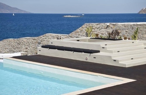 Agios Ioannis Villa | Luxurious Sunset Sea Front 5 Master bedroom villa with exterior hot tub.