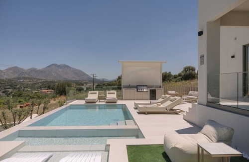 Perama Villa | Norma Villa, Heated Pool, Walk to Shops & Dining