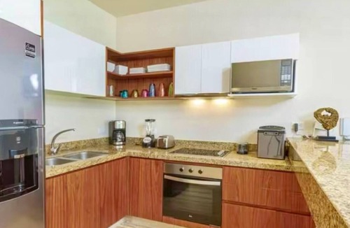Zama Apartment | Your Tulum escape awaits by HEUSHAVEN. Relax in a private rooftop pool, enjoy tropical views from 3 balconies, 3 bedrooms with smart TV's, and stay minutes from beaches, cenotes, dining, and nightlife.
