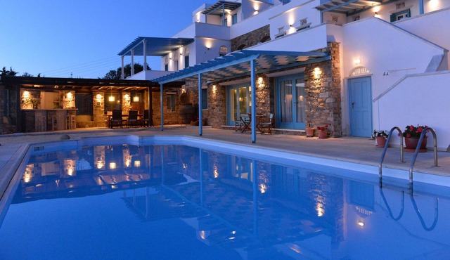 a magnificent villa in a Mediterranean garden, with shared swimming pool